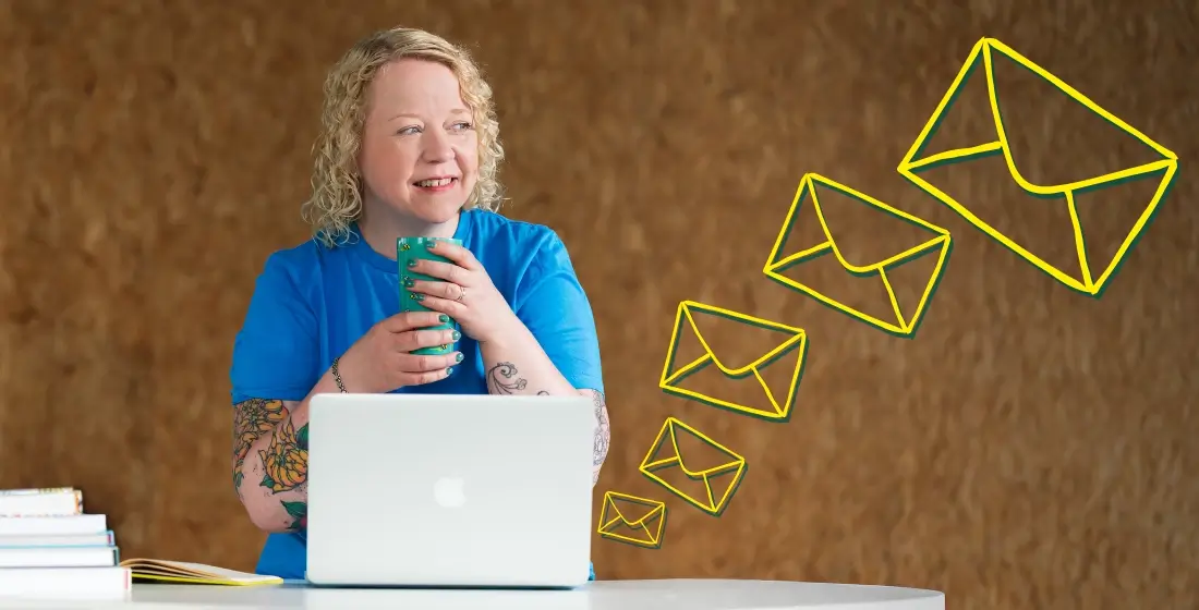 Helen Bee from B Double E sat behind a laptop, holding a large mug with both hands. She is sat to the left, looking to the right smiling. There are hand-drawn email icons over the photo coming from the laptop, drifting & getting larger as they get further away.